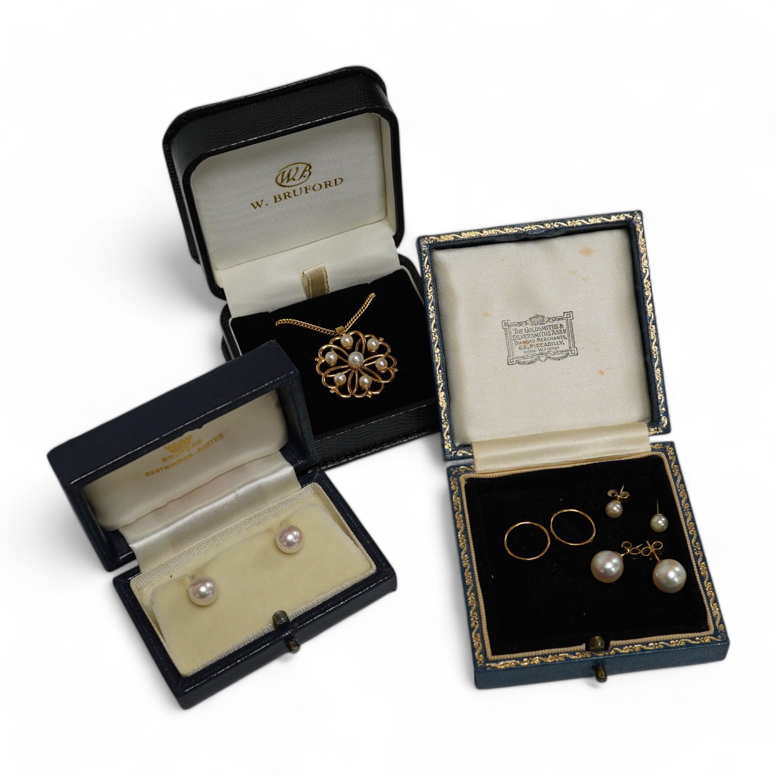 Three pairs of cultured pearl stud earrings, largest 9.3mm diameter, a pair of sleeper earrings, a gold and cultured pearl flower head pendant, stamped 9ct, with a gilt metal chain